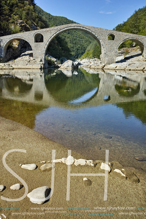 Reflection of Devil Bridge in Arda river, Kardzhali Region, Bulgaria