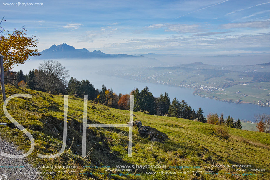 Amazing Panorama of Mount Pilatus and Lake Lucerne covered with frog, Alps, Switzerland