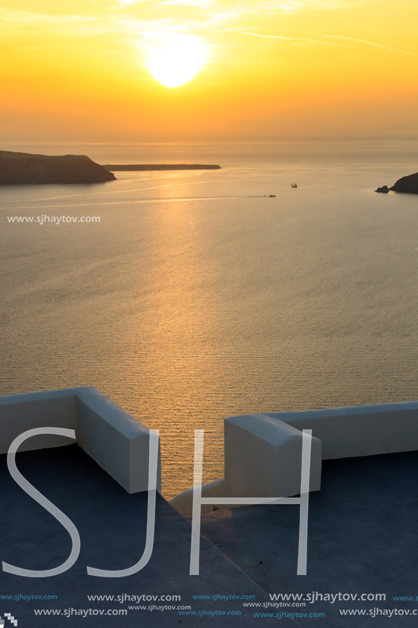 Amazing sunset view from town of Imerovigli to Aegean sea, Santorini island, Thira, Cyclades, Greece