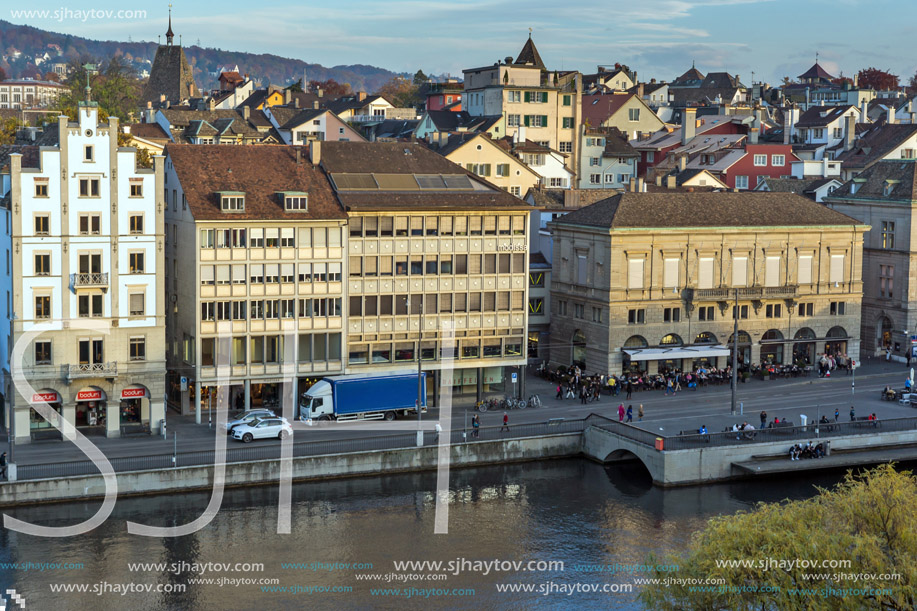 ZURICH, SWITZERLAND - OCTOBER 28, 2015: Reflection of City of Zurich in Limmat River, Switzerland