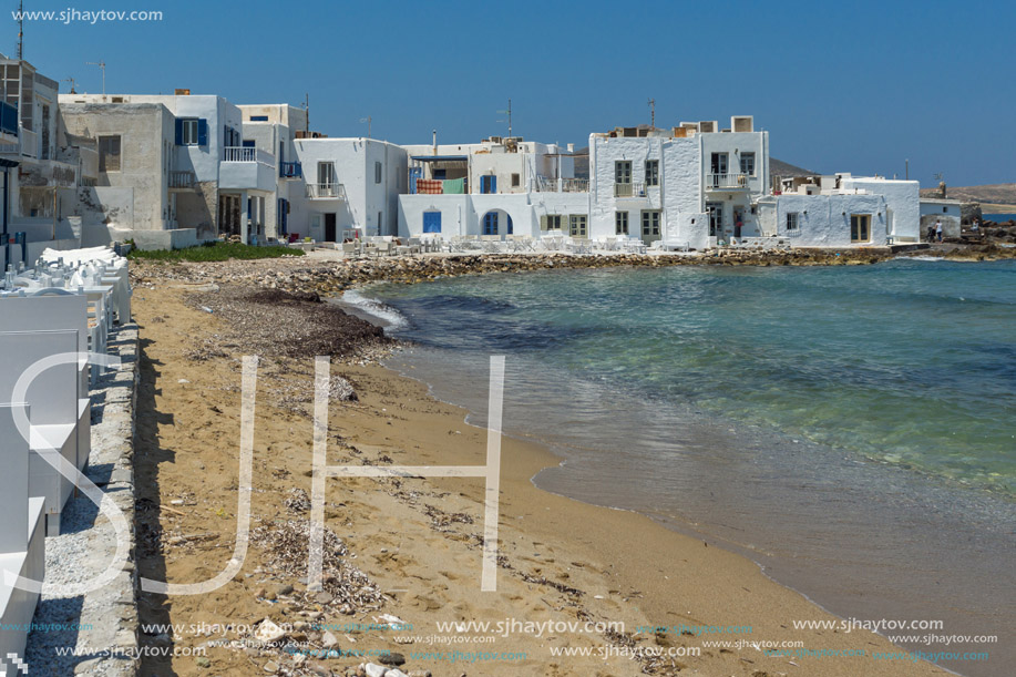 Old white house and Bay in Naoussa town, Paros island, Cyclades, Greece