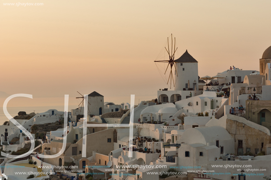 SANTORINI, GREECE - MAY 4, 2013: Amazing Sunset in town of Oia, Santorini island, Thira, Cyclades, Greece