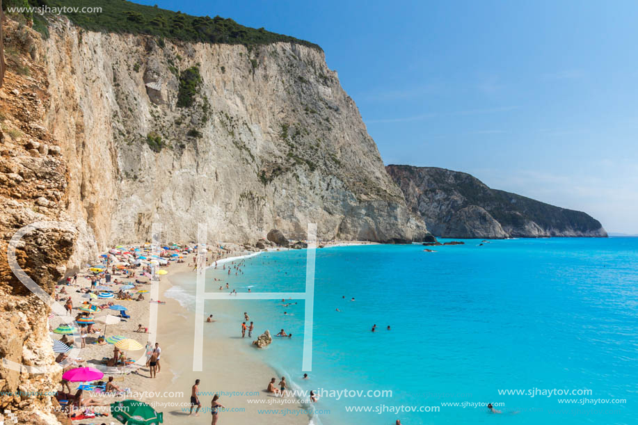 PORTO KATSIKI BEACH, LEFKADA, GREECE - JULY 16, 2014: People visiting Porto Katsiki Beach with blue waters, Lefkada, Ionian Islands, Greece