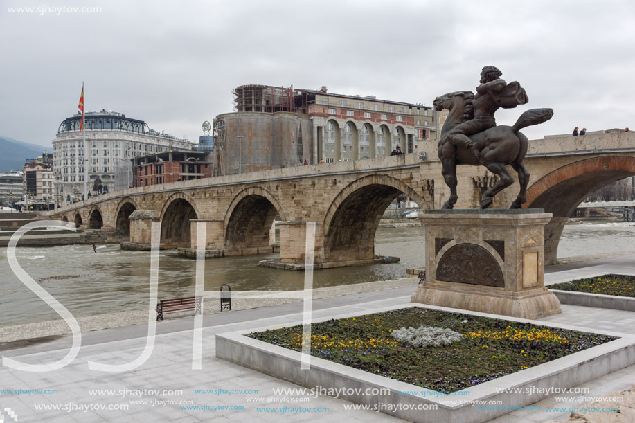 SKOPJE, REPUBLIC OF MACEDONIA - FEBRUARY 24, 2018:  Skopje City Center, Old Stone Bridge, Monument of Karposh and Vardar River, Republic of Macedonia