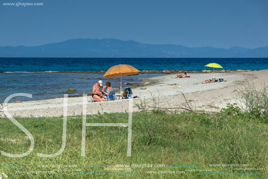 NEA FOKEA, KASSANDRA, CHALKIDIKI, GREECE - JUNE 24, 2014: Beach of Nea Fokea at Kassandra peninsula, Chalkidiki, Central Macedonia, Greece