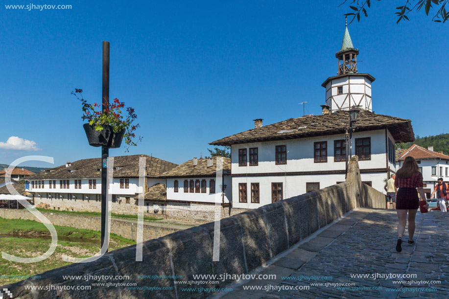 TRYAVNA, BULGARIA - JULY 6, 2018: Garbaviat (Humpback) Bridge and Medieval clock Tower at the Center of historical town of Tryavna, Gabrovo region, Bulgaria