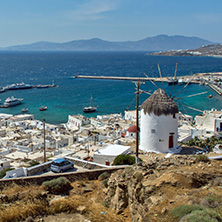 White windmill and Mykonos town, the island of Mykonos, Cyclades