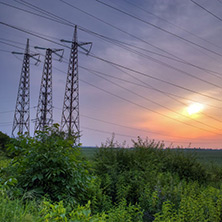 Sunset over High-voltage power lines in the land around Plovdiv, Bulgaria
