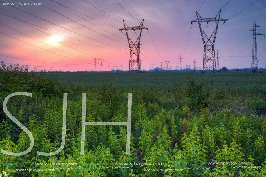 Sunset over High-voltage power lines in the land around Plovdiv, Bulgaria