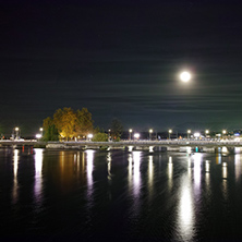 Night photo of Rhone River and Lake of Geneva, Switzerland