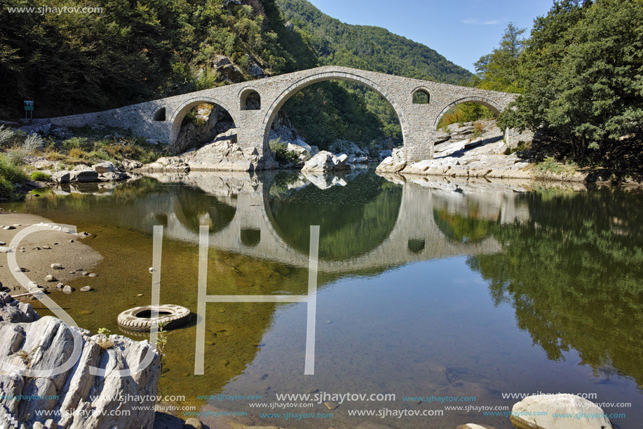 Reflection of Devil Bridge in Arda river, Kardzhali Region, Bulgaria