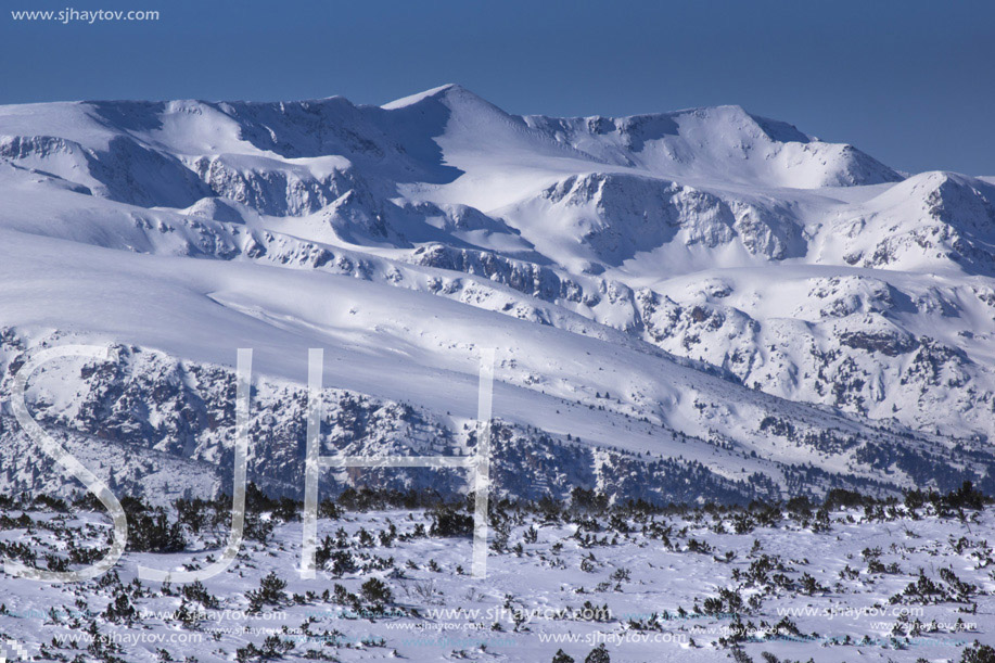 Winter view of snow-capped peaks in Rila Mountain, Bulgaria