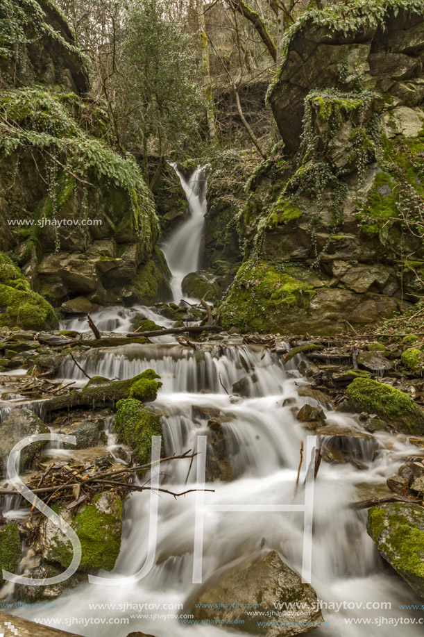 Beautiful view of Leshnishki Waterfall in deep forest, Belasitsa Mountain, Bulgaria