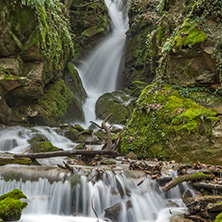 Amazing view of Leshnishki Waterfall in deep forest, Belasitsa Mountain, Bulgaria