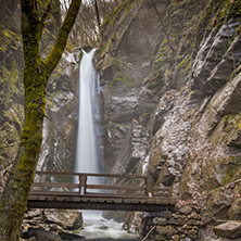 Beautiful view of Kameshnishki Waterfall in deep forest, Belasitsa Mountain, Bulgaria