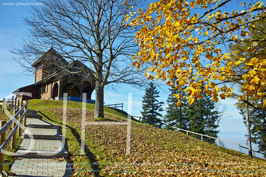 Old church and autumn trees near mount Rigi, Alps, Switzerland