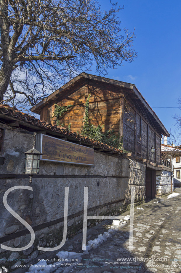Street in old town and wooden house in Bansko,  Blagoevgrad region, Bulgaria