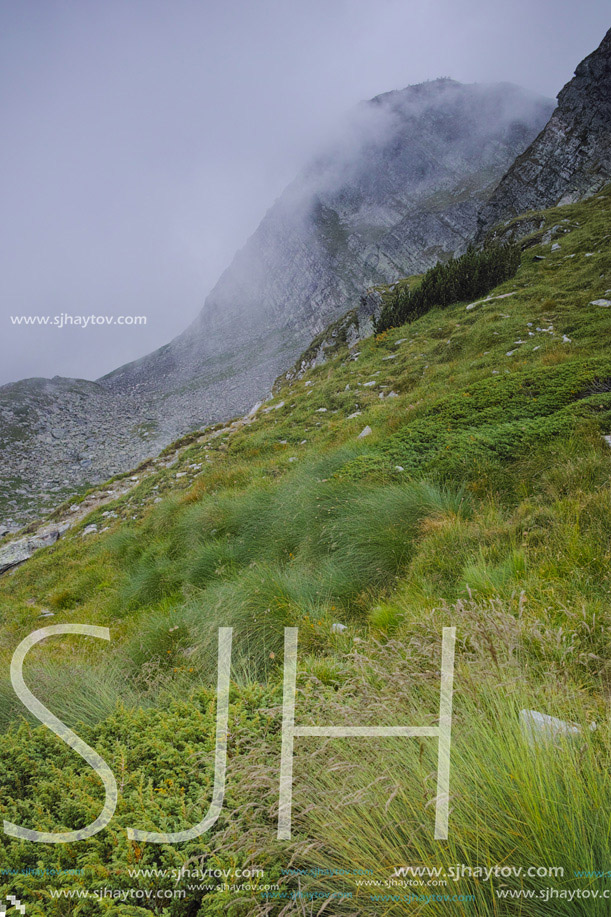 amazing Panorama of Rila Mountain with fog near The Seven Rila Lakes, Bulgaria