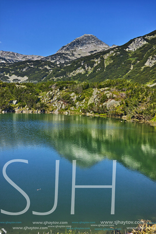 Reflection of Muratov peak in Okoto lake, Pirin Mountain, Bulgaria