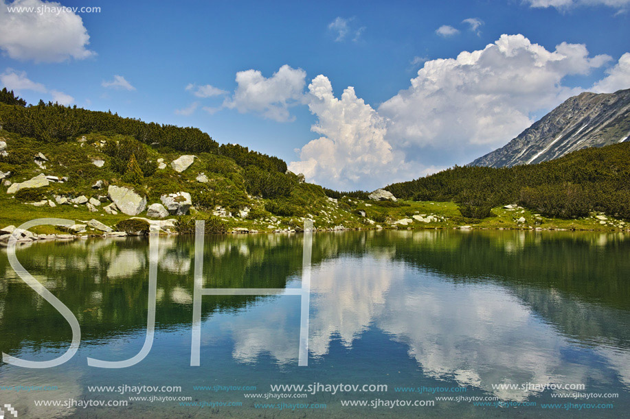 Reflection of clouds in Muratovo lake, Pirin Mountain, Bulgaria