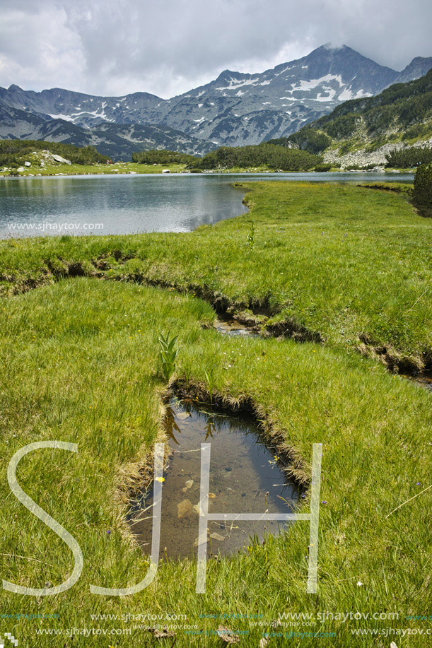 Landscape of Banderishki Chukar peak and reflection in Muratovo lake, Pirin Mountain, Bulgaria