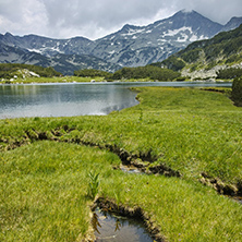 Landscape of Banderishki Chukar peak and reflection in Muratovo lake, Pirin Mountain, Bulgaria