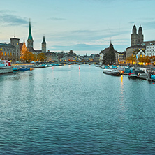 Sunset panorama of city of Zurich and reflection in Limmat River, Switzerland