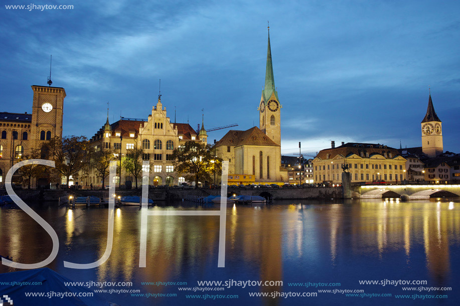 Night panoramic photo of city of Zurich and reflection in Limmat River, Switzerland