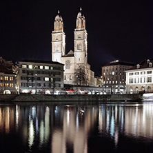 Reflection of lights of  Grossmunster church in  Limmat River,  city of Zurich, Switzerland