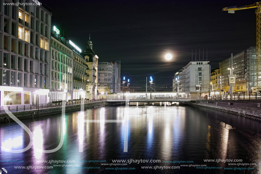 Amazing night photo of City of Geneva and Reflection in Rhone River, Switzerland