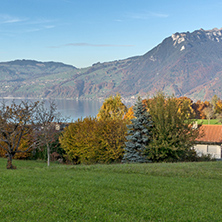 Amazing panorama of Lake Thun and typical Switzerland village near town of Interlaken, canton of Bern