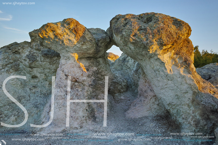 The first rays of the sun over  The Stone Mushrooms near Beli plast village, Kardzhali Region, Bulgaria