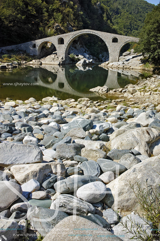 Reflection of Devil"s Bridge and Rhodopes mountain in Arda river, Kardzhali Region, Bulgaria