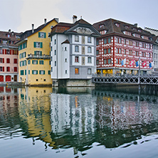 City of Luzern and reflection of old town in The Reuss River, Switzerland