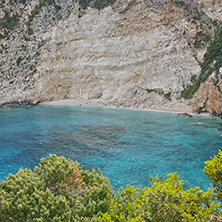 Blue water and rocks of small beach at Zakynthos island, Greece