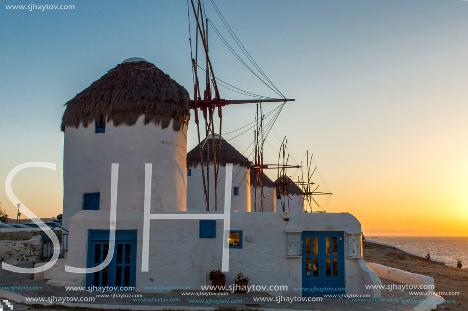 Amazing Sunset and White windmills on the island of Mykonos, Cyclades, Greece