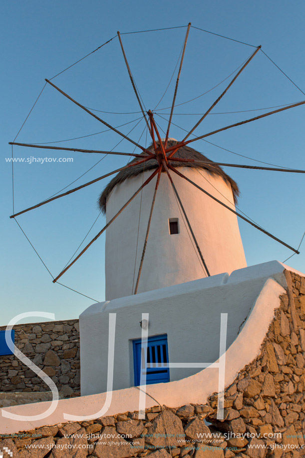 Sunset view of White windmills on the island of Mykonos, Cyclades, Greece