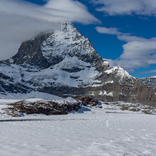 Amazing panorama of matterhorn peak covered with clods, Alps, Switzerland