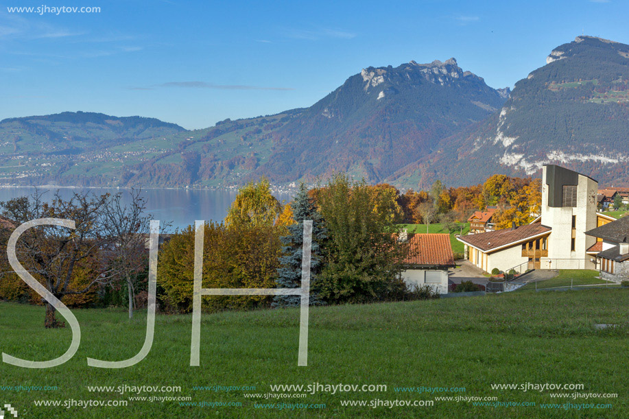 Amazing panorama of Lake Thun and typical Switzerland village near town of Interlaken, canton of Bern