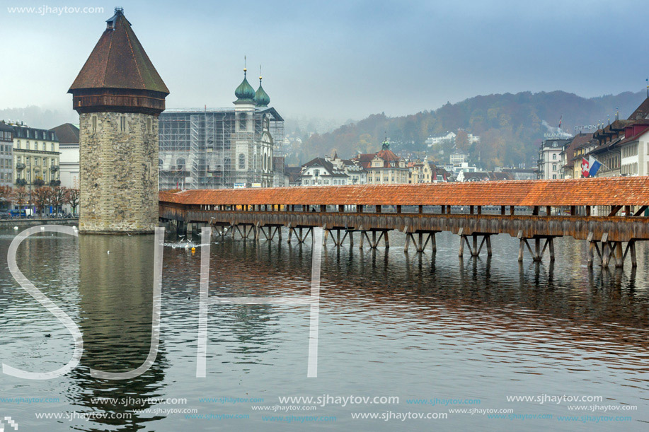 Foggy morning Chapel Bridge over Reuss River, Lucerne, Switzerland