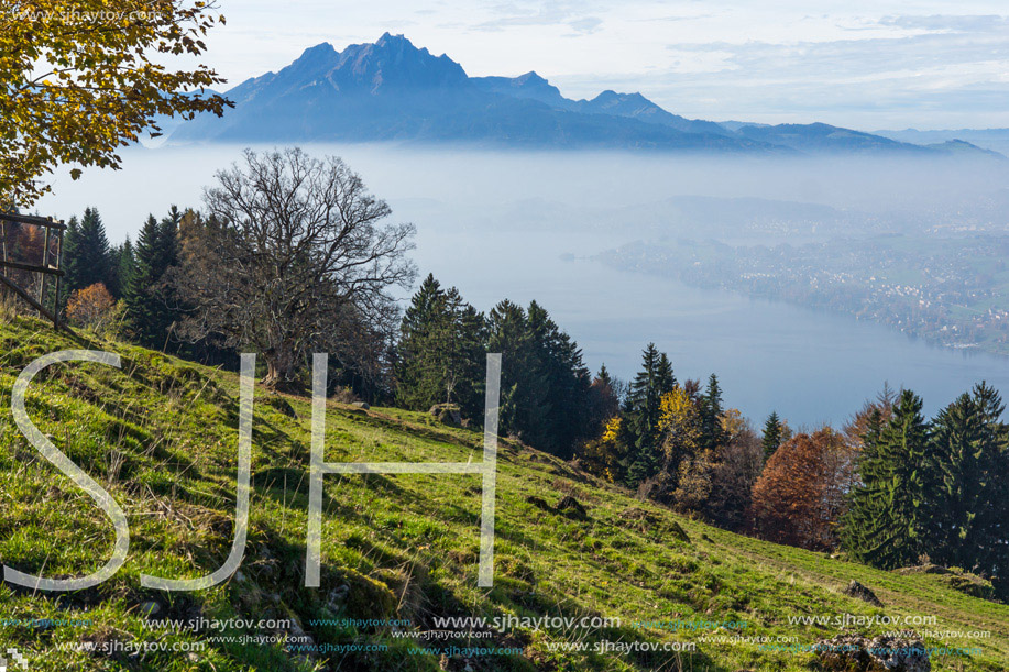 Amazing Panorama of Mount Pilatus and Lake Lucerne covered with frog, Alps, Switzerland