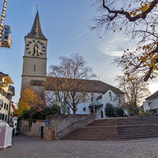 Amazing view of St. Peter Church and autumn trees, City of Zurich, Switzerland