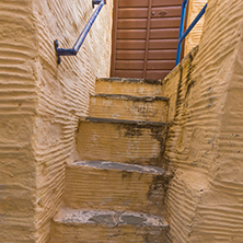 Yellow staircase in old town of Ermopoli, Syros, Cyclades Islands, Greece