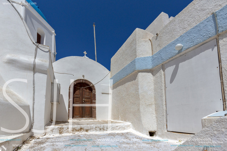 Street and small church In the castle of Pyrgos Kallistis, Santorini island, Thira, Cyclades, Greece