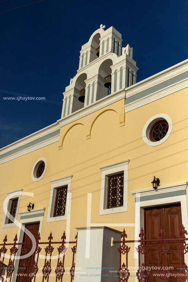 Sunset over yellow church, Fira, Santorini island, Thira, Cyclades, Greece