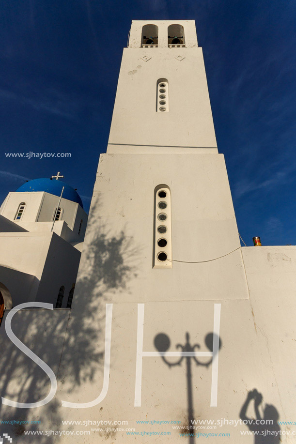 White bell tower in town of Firostefani, Santorini island, Thira, Cyclades, Greece