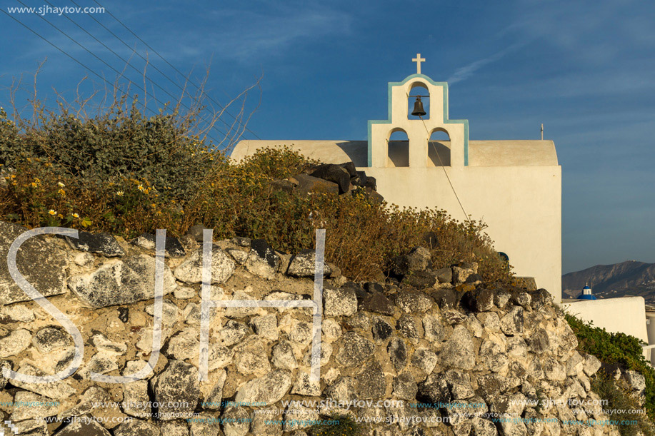 Small church with bell tower in town of Firostefani, Santorini island, Thira, Cyclades, Greece