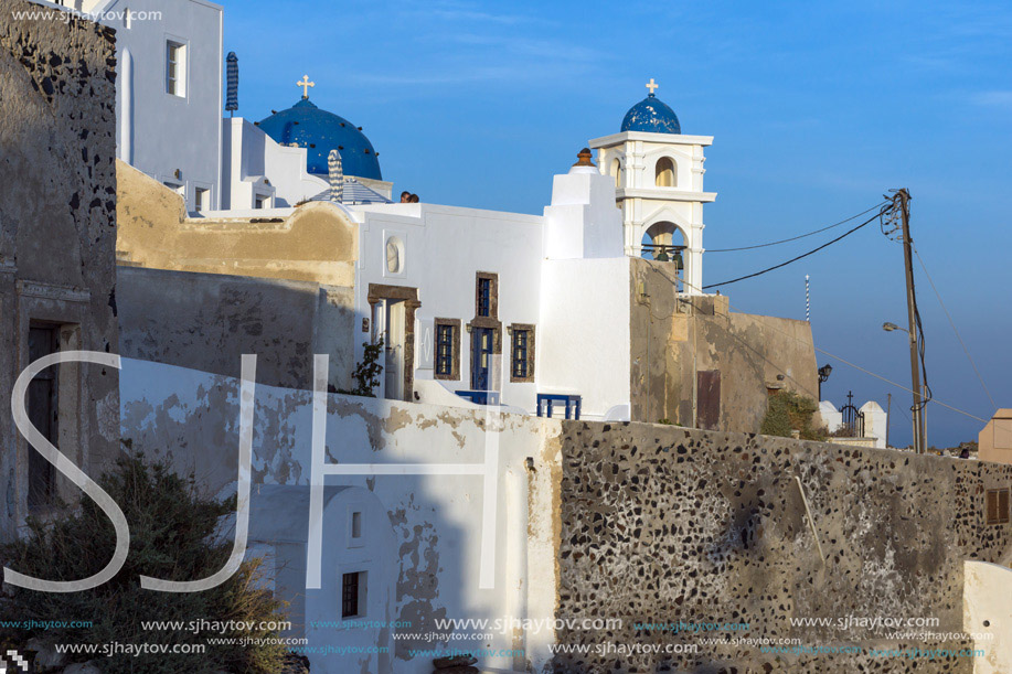 White house and churches in town of Imerovigli, Santorini island, Thira, Cyclades, Greece