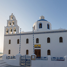 White Orthodox church in town of Oia, Santorini island, Thira, Cyclades, Greece