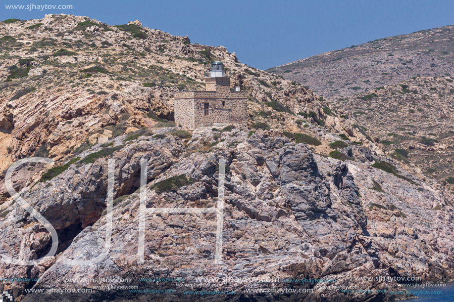 Lighthouse of entrance of port of Ios island, Cyclades, Greece